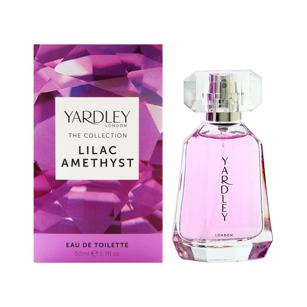 Lilac Amethyst Eau De Toilette in a clear glass bottle with a faceted cap, featuring a pink liquid, accompanied by a vibrant purple geometric box.