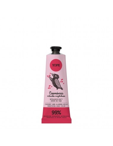 Pink tube of YOPE Hand Cream featuring a cherry almond milk scent, with a black cap and whimsical owl illustration, labeled as 99% natural ingredients.