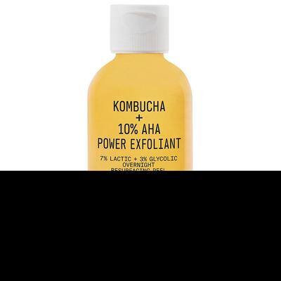 Yellow bottle with a white cap, labeled "Kombucha + 10% AHA Power Exfoliant," featuring details about its exfoliating ingredients and overnight use.