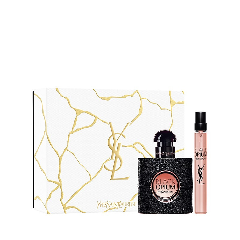 Black Opium gift set featuring a 30ml black glittery bottle and a 10ml pink travel spray, packaged in a white box with gold marbling and the YSL logo.