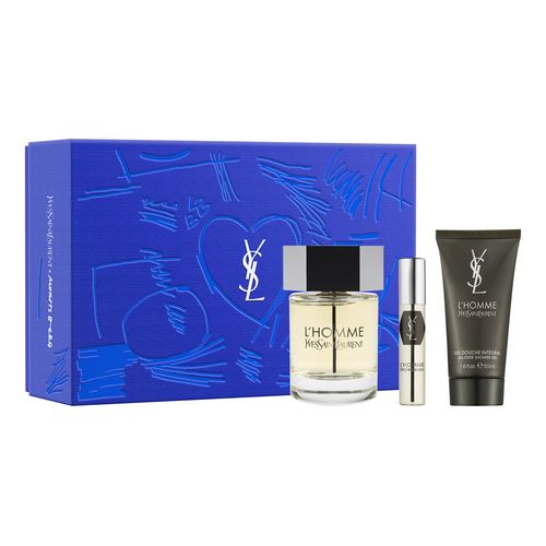 Yves Saint Laurent L'Homme gift set featuring a clear glass fragrance bottle, a travel-sized spray, and a moisturizing cream, all presented in a vibrant blue box with artistic designs.