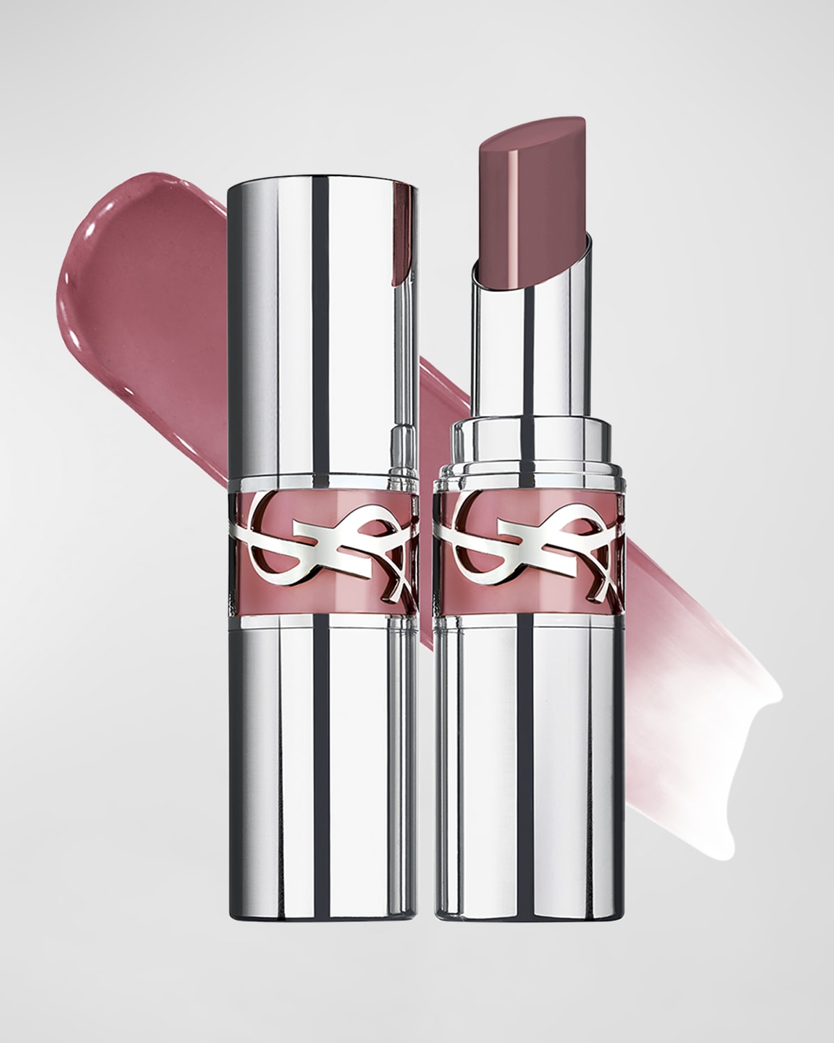 Yves Saint Laurent Loveshine High Shine Lipstick in a sleek silver tube, featuring a glossy pink bullet and a swatch of soft pink lipstick behind it.