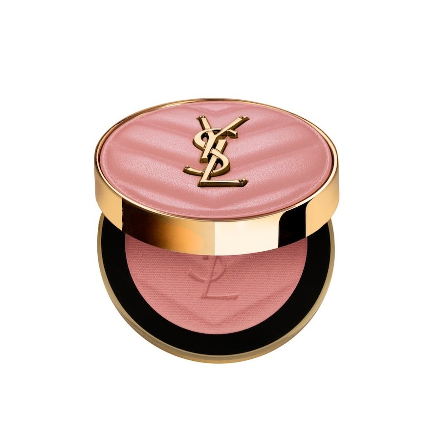 Round compact featuring a soft pink blush with a quilted texture, adorned with a gold YSL logo on the lid, showcasing a rich rose hue inside.