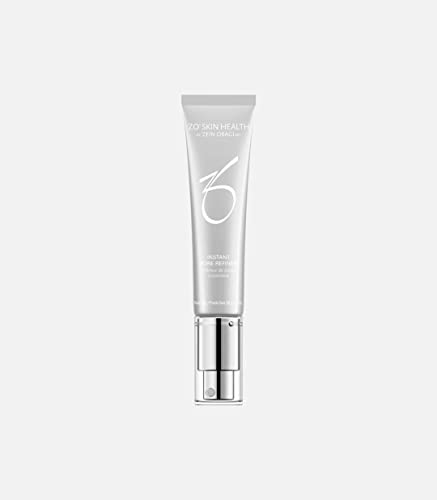 Silver tube of ZO Skin Health Instant Pore Refiner with a sleek design, featuring a pump dispenser and minimalist branding in white.