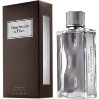 Clear glass bottle with wavy design, silver cap, and brown box labeled "Abercrombie & Fitch First Instinct Homme."