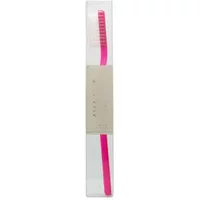 Pink Acca Kappa toothbrush with soft nylon bristles in clear packaging.