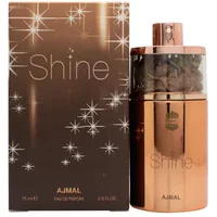 Ajmal Shine Eau De Parfum 75ml in a rose gold bottle with a matching box featuring star-like sparkles.