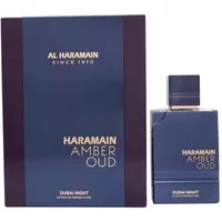 Al Haramain Amber Oud Dubai Night perfume, 75ml, in a sleek dark blue bottle with matching box, gold lettering.
