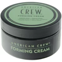 Black round container of American Crew Forming Cream with green label and bold black text.