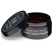 Black jar of American Crew Heavy Hold Pomade, open lid, white text on top, 85g size.