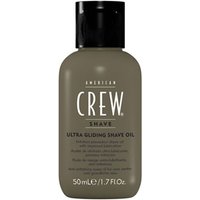 Gray bottle of American Crew Ultra Gliding Shave Oil, 50ml, with black cap and white text detailing.