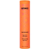Bright orange cylindrical bottle of Amika normcore Signature Shampoo, 275ml, with black text and floral pattern.