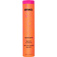 Amika Normcore Signature Conditioner 275ml, tall orange bottle with pink cap and floral pattern.
