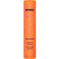 Orange Amika Normcore Signature Shampoo bottle, 275ml, with floral pattern and black text.