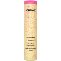 Amika Velveteen Dream Smoothing Conditioner, 275ml, in a tall yellow bottle with pink cap and floral design.