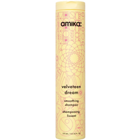 Amika Velveteen Dream Smoothing Shampoo 275ml, yellow bottle with intricate floral design and bold black text.