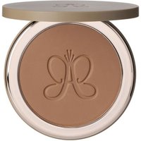 Anastasia Beverly Hills contour stick, beige shade, embossed with logo, in a sleek round compact with metallic lid.