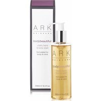 Clear bottle of Ark Skincare Vitality Hand & Body Wash with pump, next to purple-accented box.