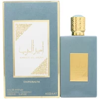 Blue and gold Asdaaf Ameer Al Arab Imperium perfume bottle with matching box, gold cap, and Arabic script.