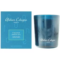 Blue Atelier Cologne Figuier Andalou candle in glass holder, with matching blue box featuring white text.