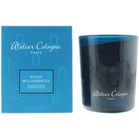 Atelier Cologne Wood Wilderness Candle 180g in dark blue glass with matching blue box featuring white logo.
