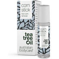 Clear bottle with gray cap labeled "corn stick" beside patterned box, featuring "tea tree oil" text.