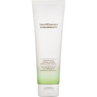 White tube of bareMinerals foaming cleanser with green gradient base and black text.