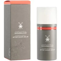 Mühle after shave balm in gray bottle with white cap, grapefruit and mint scent, next to matching gray box.