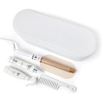 White Beauty Works Deluxe Dream Vanity set with curling wand, two styling products, and a white comb.