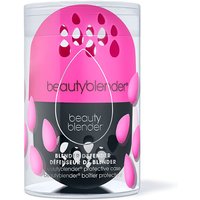 Pink and black Beautyblender Blender Defender case with teardrop design in clear cylindrical packaging.