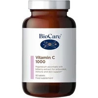 Brown BioCare bottle with white label, blue logo, and text "Vitamin C 1000mg 90 Tablets" in purple and black.