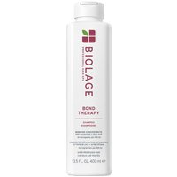 Biolage Bond Therapy Shampoo 400ml, white cylindrical bottle with green leaf logo and purple text.