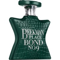 Dark green star-shaped perfume bottle with crocodile texture, silver cap, and "Beekman Place Bond No. 9" text.