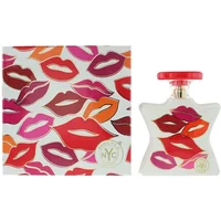 White Bond No 9 Nolita perfume bottle with colorful lips design, red cap, and matching box.