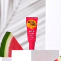 Red Bondi Sands SPF 50+ Lip Balm tube with yellow logo, watermelon slice background, 10g size.