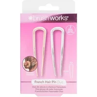 Gold and silver U-shaped French hair pins by Brushworks on pink packaging.