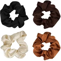 Four satin scrunchies in black, dark brown, cream, and caramel shades from Brushworks.