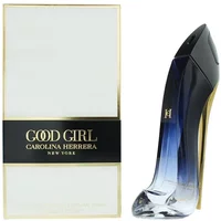 Blue stiletto-shaped Carolina Herrera perfume bottle with black cap, next to white box with gold accents.