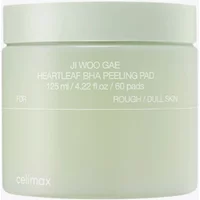 Light green CELIMAX Heartleaf BHA Peeling Pad jar, 125ml, with white text and a smooth, round lid.