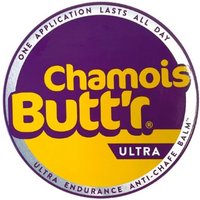 Round purple and yellow Chamois Buttr Ultra Balm tub with white text and purple border.