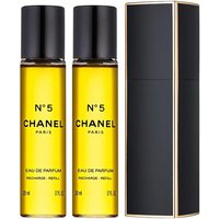 Chanel No. 5 Gift Set with two yellow perfume bottles and sleek black case with gold trim.