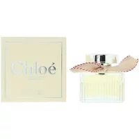 Chloé L'Eau De Parfum Lumineuse 50ml bottle with pleated glass and beige bow, next to matching cream box.