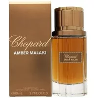 Chopard Amber Malaki Eau De Parfum 80ml, amber liquid in clear bottle with gold cap, next to matching gold box.