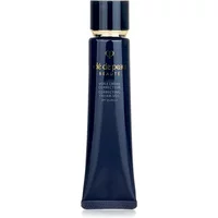 Navy blue tube of Clé de Peau Beauté Correcting Cream Veil SPF 25 with gold accents, 37ml size.