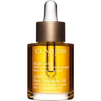 Clarins Face Treatment Oil Lotus 30ml in amber glass bottle with dropper and gold cap.