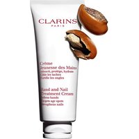 White Clarins Hand and Nail Treatment Cream tube with red text, featuring cracked shea nuts.