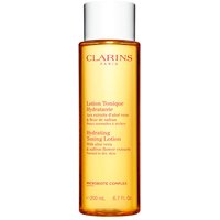 Clarins Hydrating Toning Lotion 200ml in a clear amber bottle with white cap and red text.