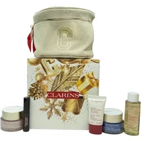 Clarins holiday set with cream jars, tube, oil bottle, mascara, gold box, and beige pouch with gold "C".