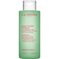 Green Clarins Purifying Toning Lotion bottle, 400ml, with white cap and red text detailing ingredients and benefits.