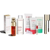 Clarins Double Serum 50 ml with gold pump bottle, surrounded by various Clarins skincare and makeup products.